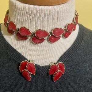 Choker necklace with matching clip-on earrings.Silver tone with red leave design